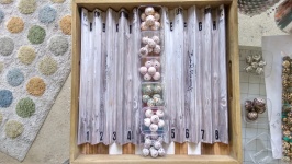 Place your Bead Runway in a tray to keep beads from rolling off and start by picking your largest focal beads and build an inspired design around them